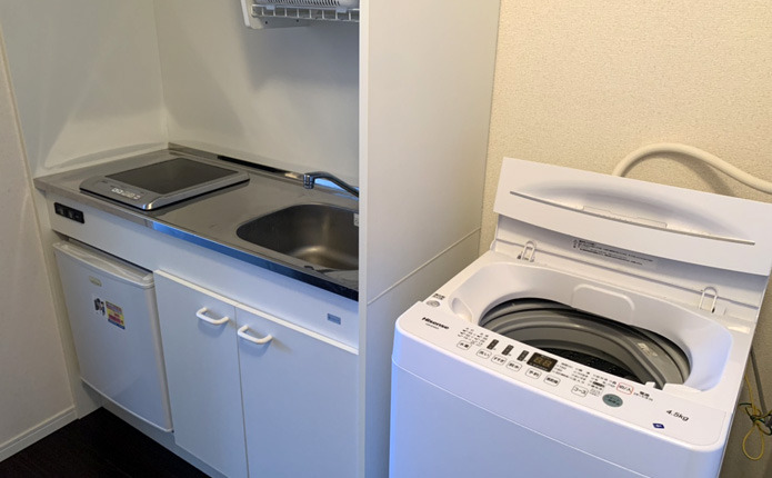 デイジーヒル イーストのキッチンと洗濯機の写真